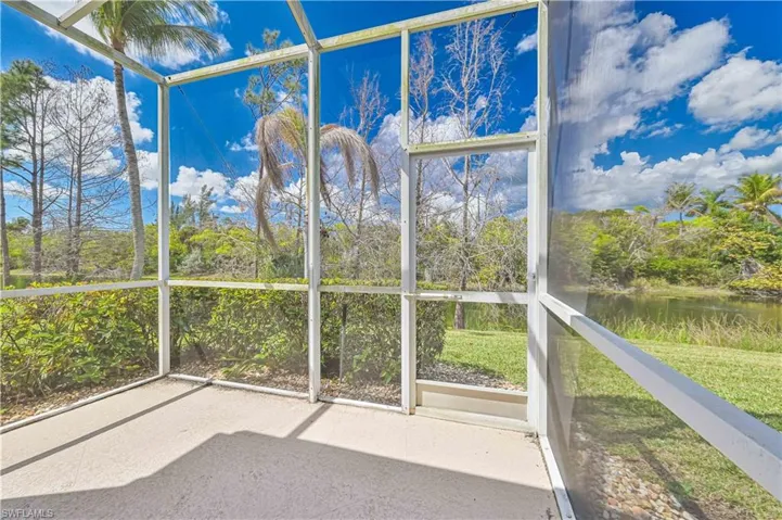 Unfurnished sunroom with a water view