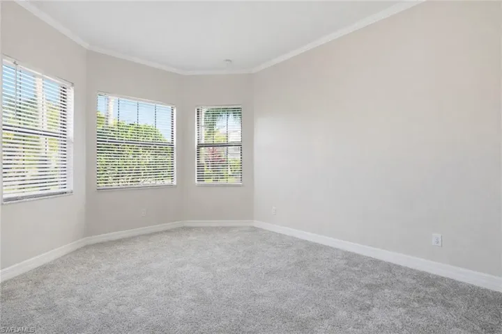 1st Bedroom / Front of house. Freshly painted, new carpet, built in shelving in closet, bathroom right outside the door