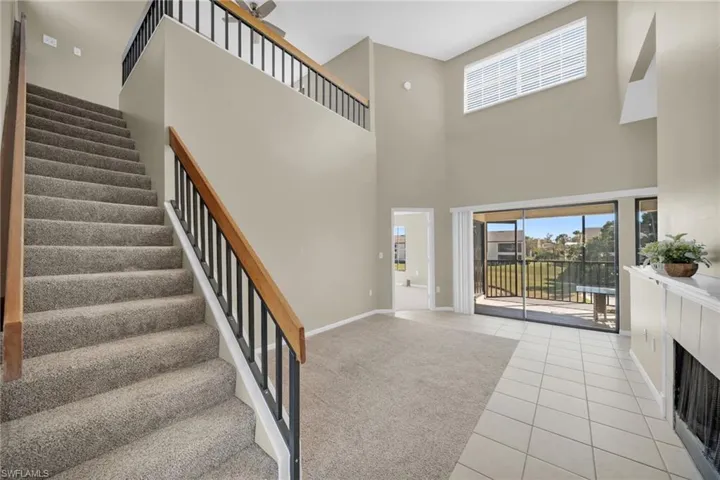 Stairs from living room leading to the upstairs level.