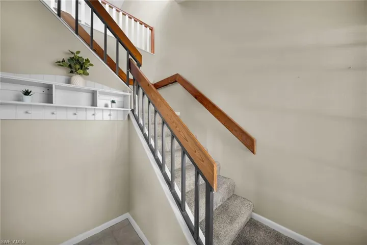 Stairs from living room leading to the upstairs level.