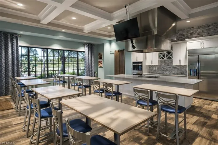 Dining area featuring dark wood-style floors, coffered ceiling, recessed lighting, and crown molding