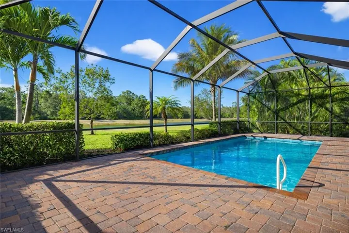 Swimming pool featuring a lanai and a sunroom