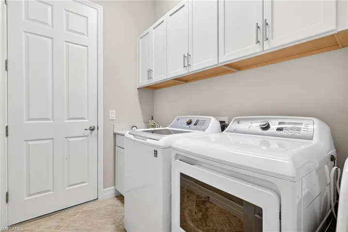 Laundry area with washing machine and dryer and cabinet space