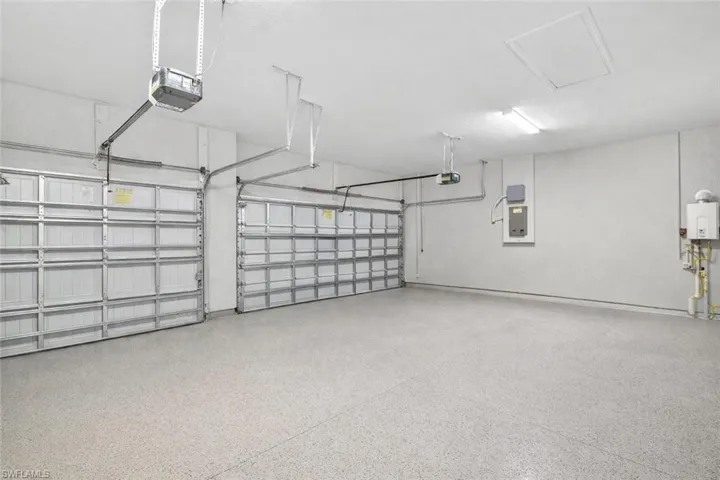 Garage with a garage door opener and water heater