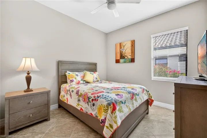 Bedroom featuring baseboards and a ceiling fan