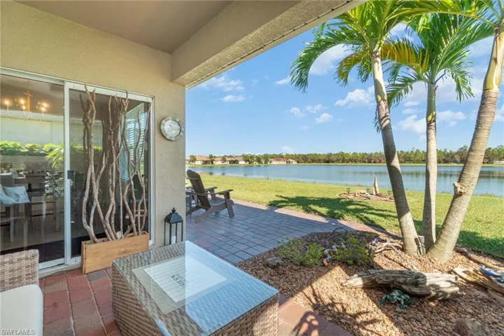 View of patio with a water view