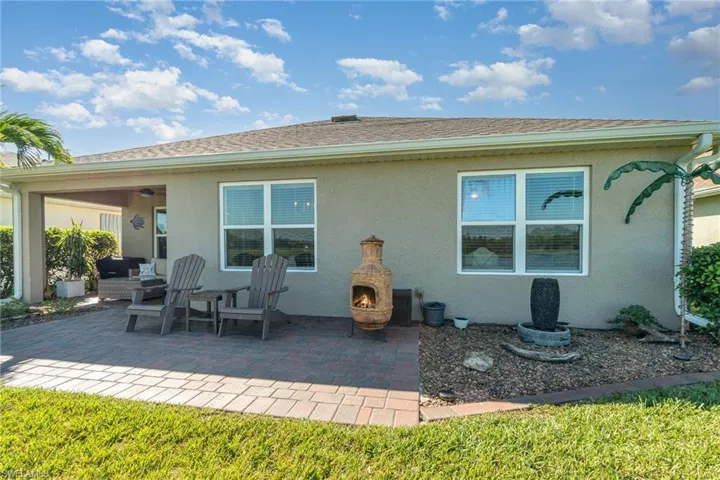 Back of property with a patio area and ceiling fan