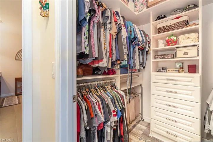 Walk in closet featuring light wood-type flooring