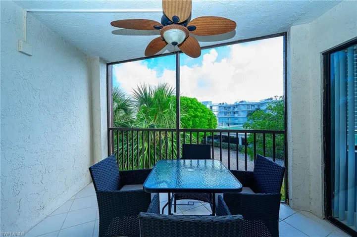 Balcony featuring ceiling fan