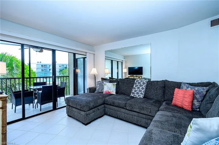 Living room with light tile patterned floors