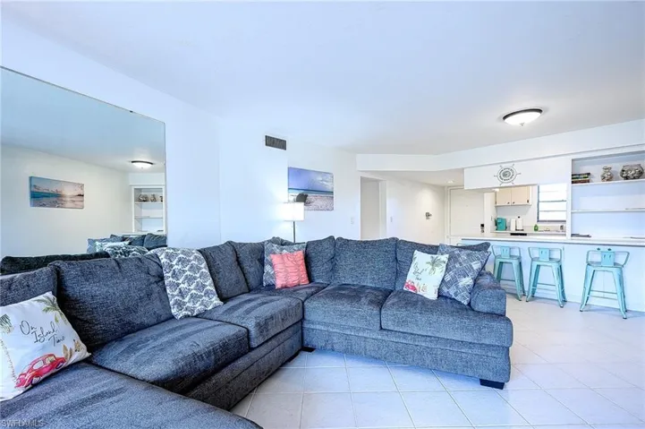 Living room with light tile patterned floors