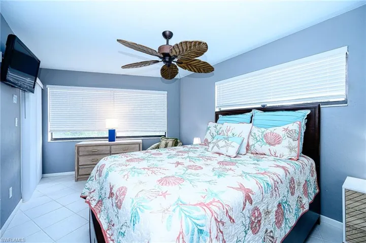 Tiled bedroom with ceiling fan