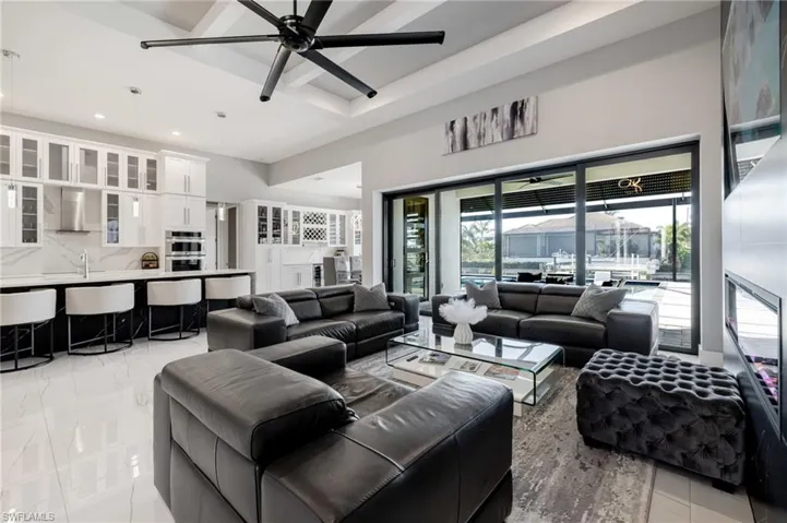 Living room featuring ceiling fan and recessed lighting