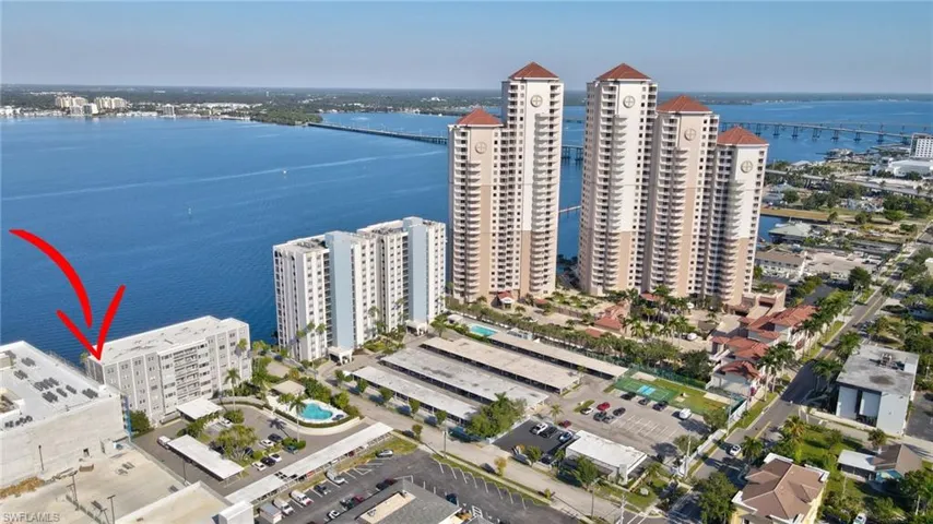 Condo view with pool and neighbors