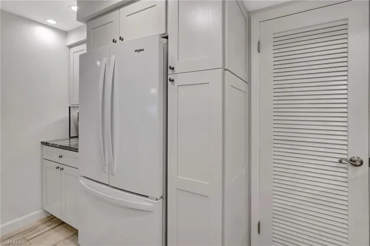 Kitchen featuring refrigerator w/ice maker, coffe bar and a pantry