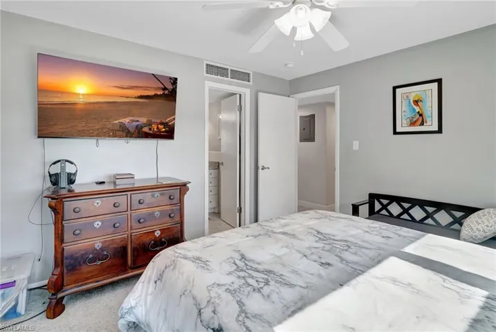 Master Bedroom featuring, ceiling fan, ensuite bathroom, and TV