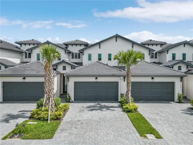 View of property featuring a garage