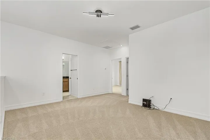 Spare room with light carpet
