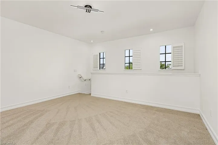 Spare room featuring carpet