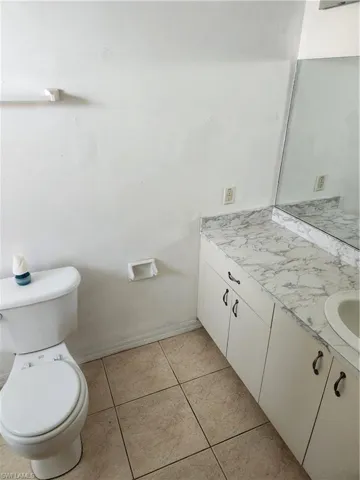 Bathroom with vanity and light tile patterned floors
