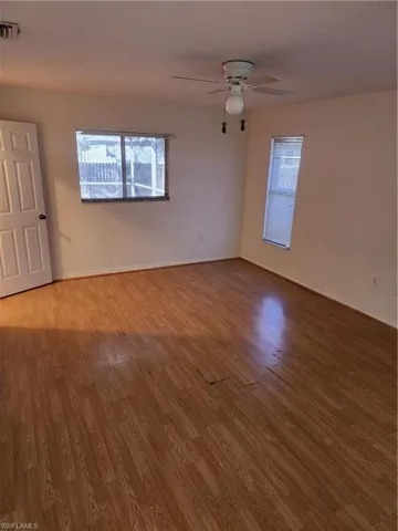 Spare room with light wood-type flooring and ceiling fan