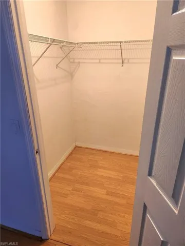 Walk in closet featuring light wood-type flooring