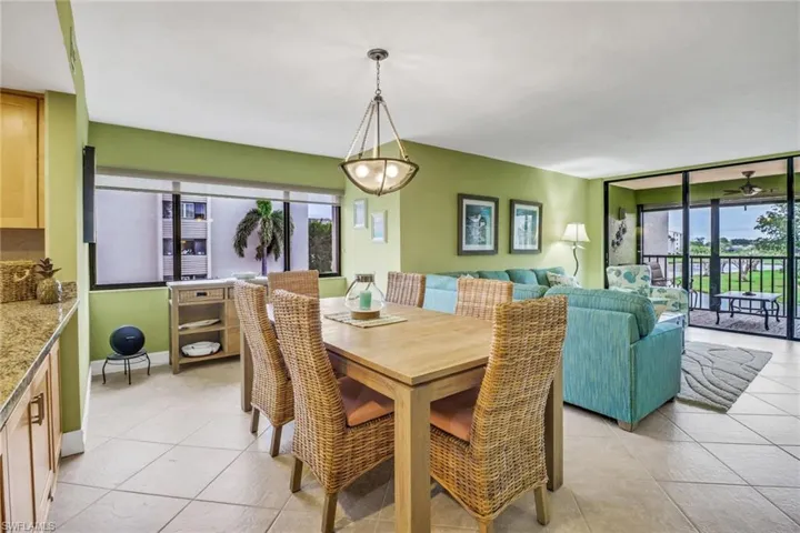 Dining area with light tile patterned floors
