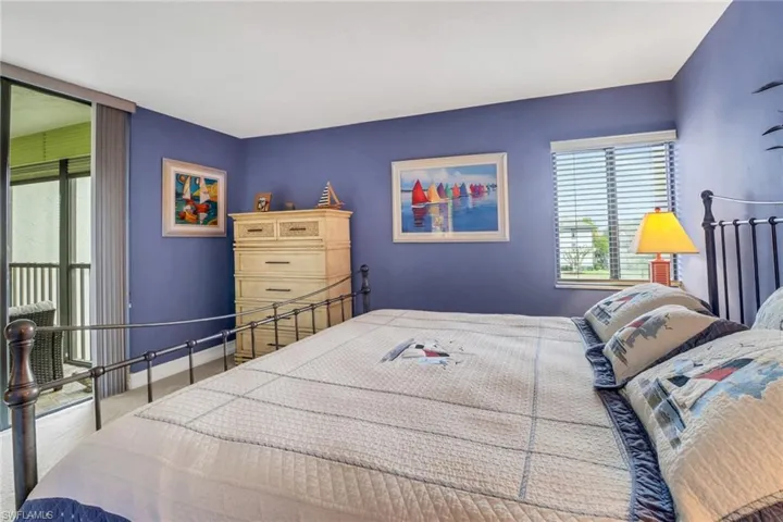 Bedroom featuring light colored carpet