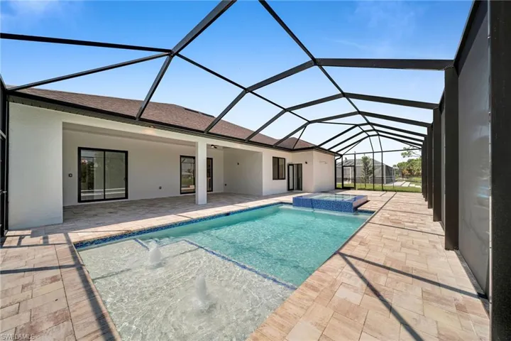 View of pool featuring a patio area and a lanai