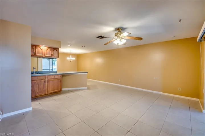 Living area looking into dining area. Wet bar/counter in living room side