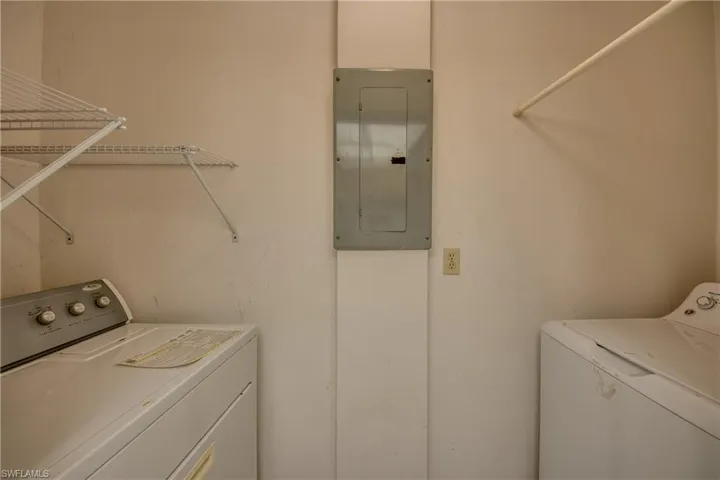 Clothes washing area with electric panel and washer and dryer