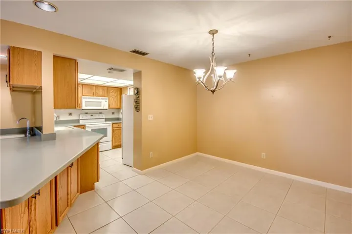 Dining Room with Kitchen in background