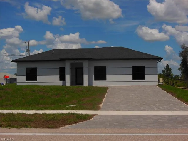 Contemporary home featuring stucco siding and roof with shingles