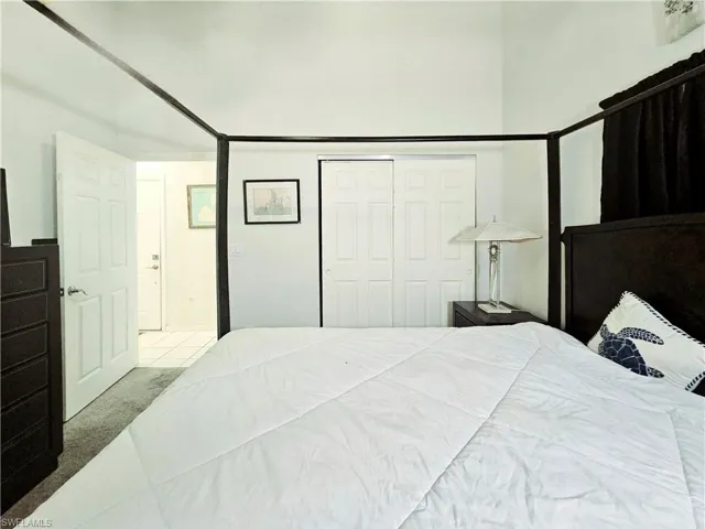 Bedroom featuring carpet floors and a closet