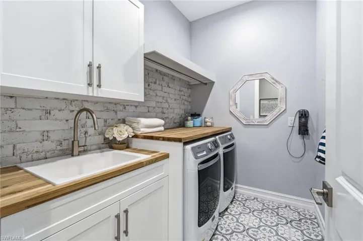 Custom mud room/ laundry is situated off of the owners entry/3 car garage.