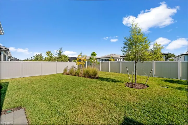 View of fenced backyard