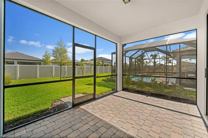 Unfurnished sunroom with a patio