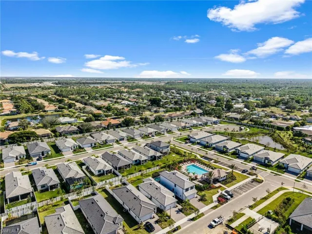 Aerial perspective of suburban area with a large body of water