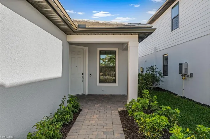 Property entrance with stucco siding