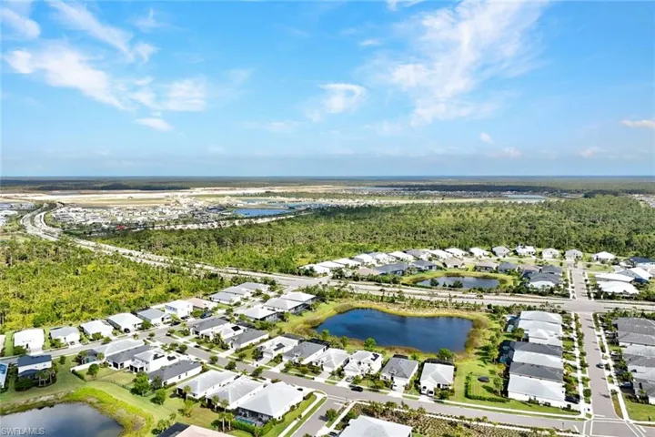 Aerial perspective showcasing a residential community with numerous single-story homes