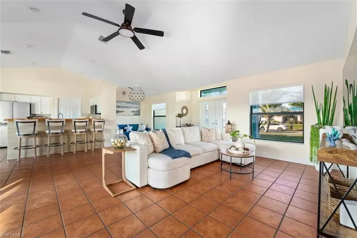 Playroom with finished concrete floors, pool table, and a garage