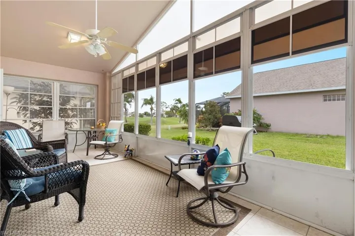 Sunroom / solarium featuring ceiling fan and lofted ceiling