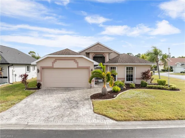 View of front facade with a garage and a front yard