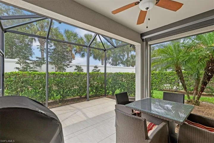 Sunroom / solarium featuring ceiling fan