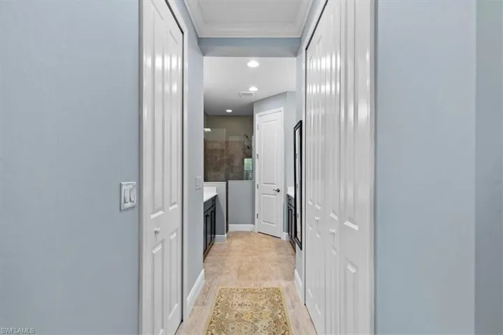 Hall with light hardwood / wood-style flooring