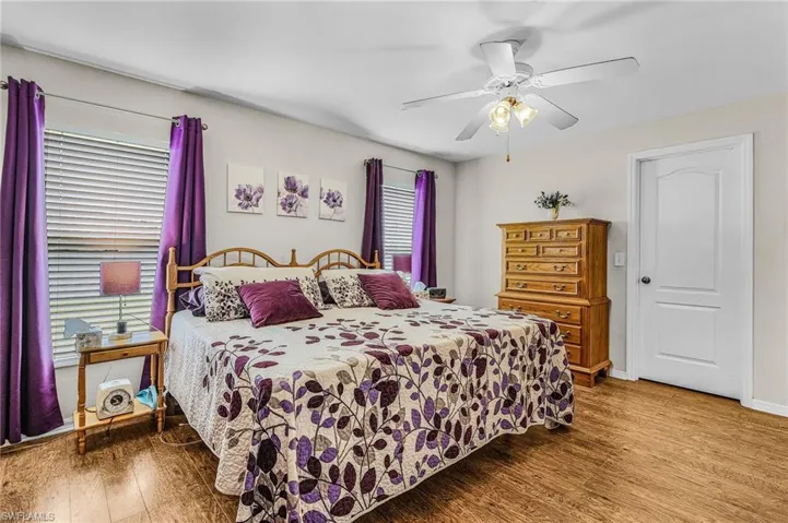 Bedroom featuring wood finished floors and a ceiling fan
