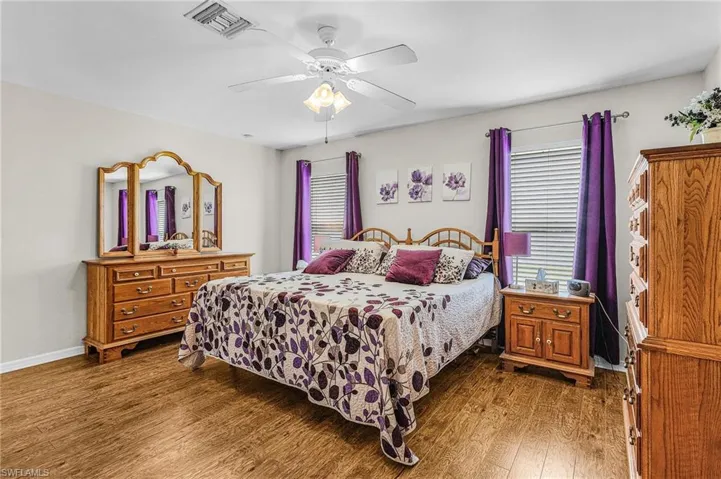 Bedroom with wood finished floors and a ceiling fan