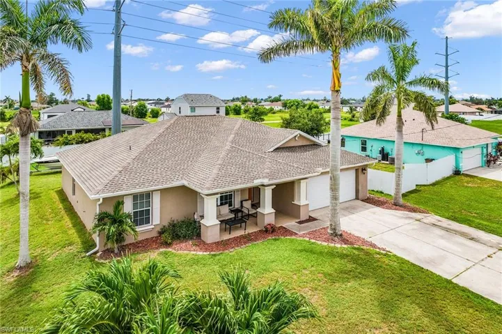 Single story home featuring stucco siding, concrete driveway, an attached garage, and a residential view