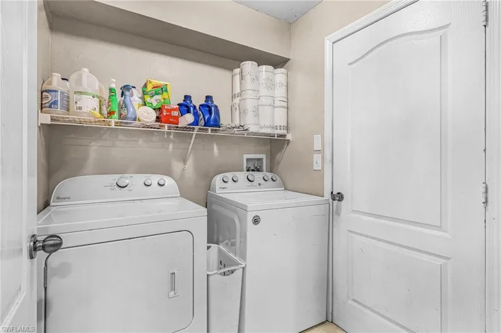 Laundry room featuring washing machine and clothes dryer