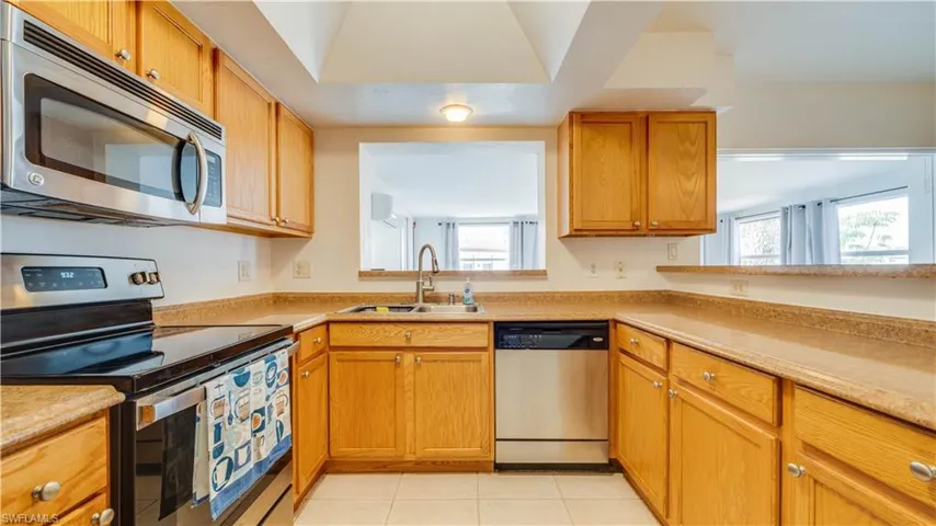 Kitchen has pass thru to back room